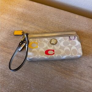 Coach Beige Wristlet with Red and Yellow Accents